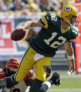Bengals Packers Football I seriously couldn't find a photo from this game where Rodgers wasn't being dragged down from behind.