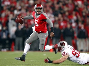 Ohio State Miller runs from Wisconsin Kelly during the fourth quarter of their NCAA football game in Columbus