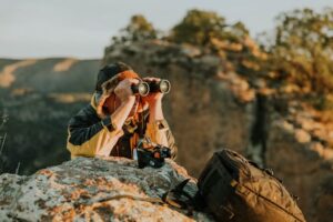 woman wearing binoculars